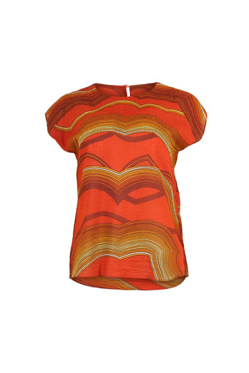Olga de Polga classic tee in Orange Aurora printed cotton seersucker. With a round neckline and cap sleeves, this tee finishes at the hip. Front view.