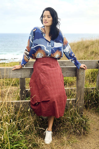 Olga de Polga Textured cotton Milwaukee skirt in burnt Orange. Front view on model