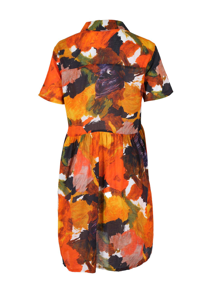 Olga de Polga Villa dropped waist dress in Orange Fiorella printed seersucker fabric. Short sleeved shirt dress with a collar and buttons down to the waist seam. Light gathering at the waist. Finishes above the knee depending on your height. Back view flat lay