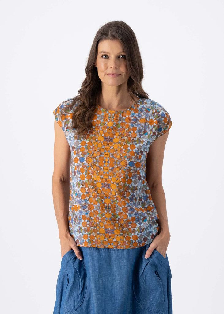 Olga de Polga Classic short sleeved tee in our Orange Kaleidoscope printed cotton seersucker. With a round neckline and boxy cut this top is perfect for every shape, and great for a big bust. Front view, close up.
