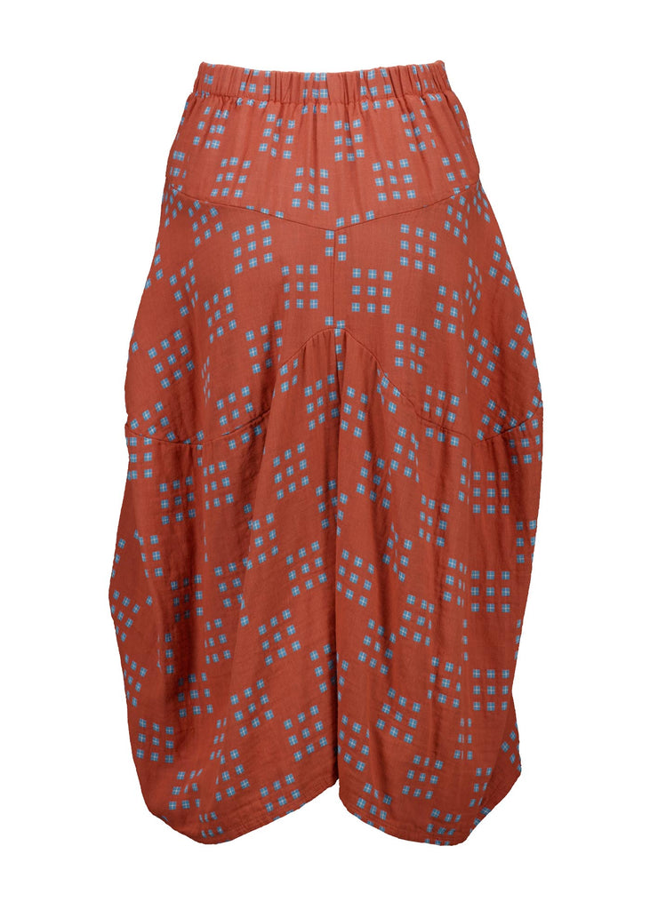 Olga de Polga Milwaukee skirt in Network Orange printed cotton. The Milwaukee is an incredibly unique, chic and original skirt. It is universally flattering, highly versatile, and super comfortable. Perfect to throw on and go. Back view.