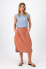 Olga de Polga Milwaukee skirt in Network Orange printed cotton. The Milwaukee is an incredibly unique, chic and original skirt. It is universally flattering, highly versatile, and super comfortable. Perfect to throw on and go. Front view on model.