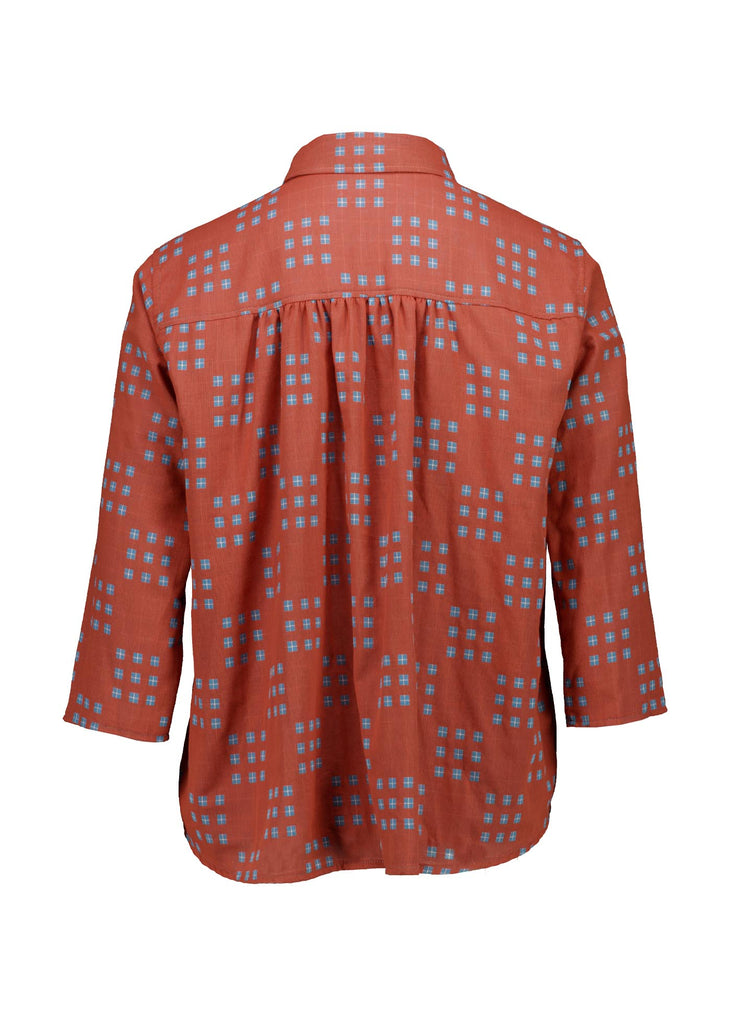 Olga de Polga Network printed cotton shirt in orange with a button down front and collar. 3/4 length sleeves with a foldable sleeve and button fastening. Back view.