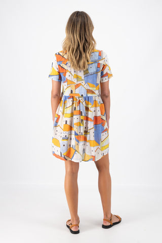 Olga de Polga Pueblito Orange villa dress in cotton seersucker fabric. Back full length view on model.