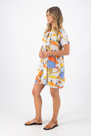 Olga de Polga Pueblito Orange villa dress in cotton seersucker fabric. Side view on model.