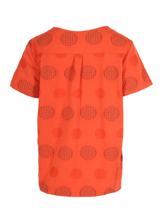 Olga de Polga Orange Universal top with a woven pattern of textured circles in the same orange. Back view 
