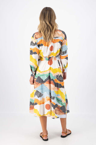 Olga de Polga Orange Vista printed Parisian Dress in 100% Viscose. Back view on model.