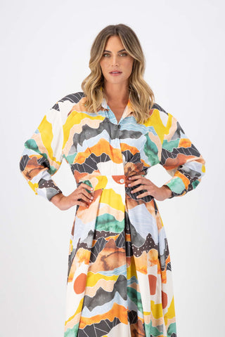 Olga de Polga Orange Vista printed Parisian Dress in 100% Viscose. Close up view on model.