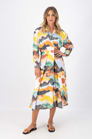 Olga de Polga Orange Vista printed Parisian Dress in 100% Viscose. Front view on model.