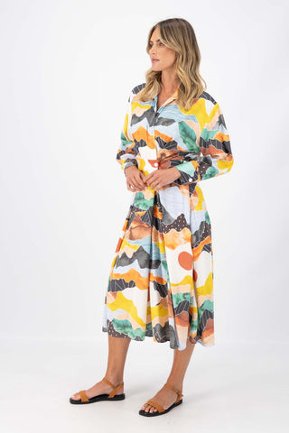 Olga de Polga Orange Vista printed Parisian Dress in 100% Viscose. Side view on model.