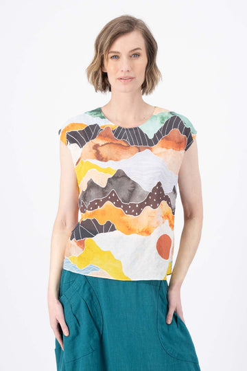 Olga de Polga Orange Vista tee in printed seersucker. Round neckline, cap sleeves, tapered at the waist. Front view on model.