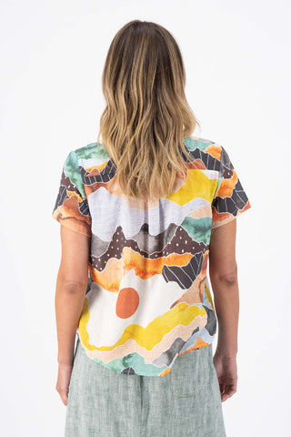 Orange Vista printed Olga de Polga classic Top in cotton seersucker. Round neck with short sleeves and a boxy shape. Back view on model.