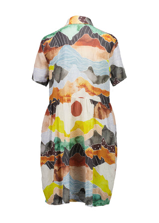 Olga de Polga Villa dress with a dropped waist in Vista Orange printed cotton seersucker. Back view.
