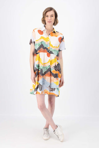Olga de Polga Villa dress with a dropped waist in Vista Orange printed cotton seersucker. Front full view on model.