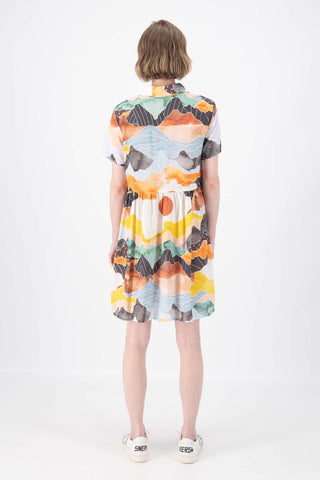 Olga de Polga Villa dress with a dropped waist in Vista Orange printed cotton seersucker. Back full view on model.