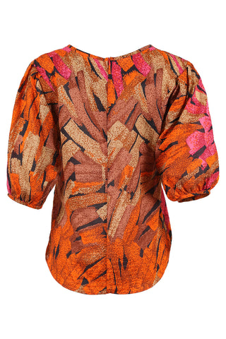 Olga de Polga classic blouse in our Orange Vivant printed cotton seersucker. With a round neck and half sleeves, this blouse finishes at the hem. Back view