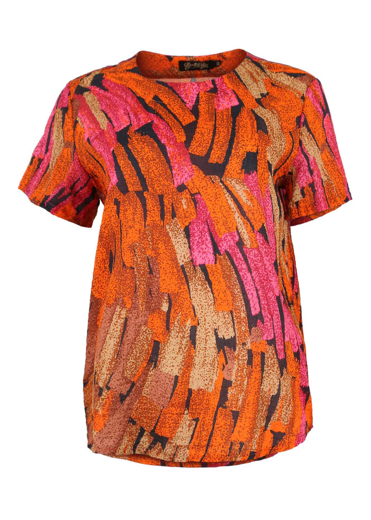 Olga de Polga classic top in our Orange Astra printed cotton seersucker. With a round neck and short sleeves, this top finishes at the hip. Front view.