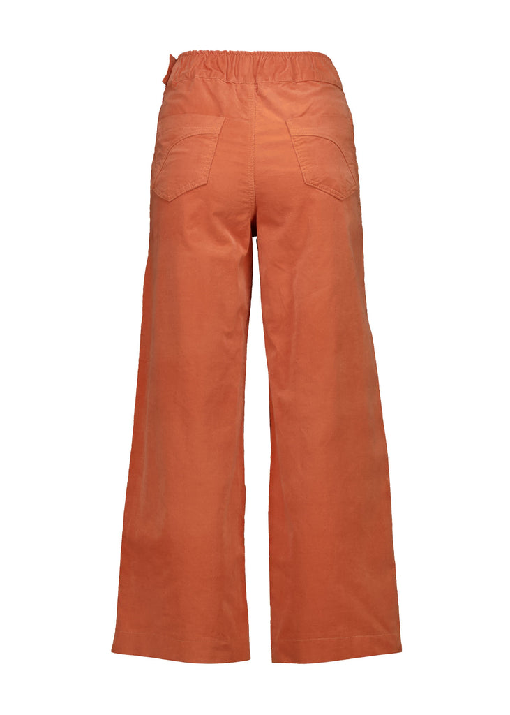 Olga de Polga Peggy Pants in Peach Fine Cotton Cord. Best seller with large front patch pockets, elasticated waistband, cropped length, side zip fastening. Back view.