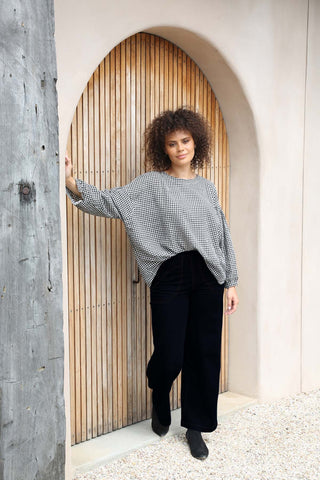 Olga de Polga Peggy Pants long in black stretch cotton canvas twill. Front view on model