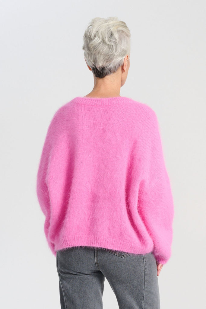 Crafted in an impossibly soft angora blend, this jumper will keep you warm on the greyest of days while still staying comfortable and light. Back view on model
