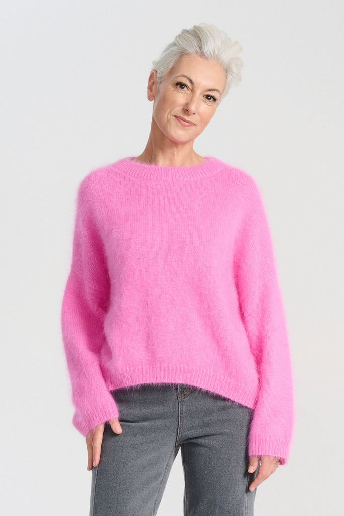 Olga de Polga angora Montreal Knit sweater in Bubblegum Pink. Crafted in an impossibly soft angora blend, this jumper will keep you warm on the greyest of days while still staying comfortable and light. Front view on model