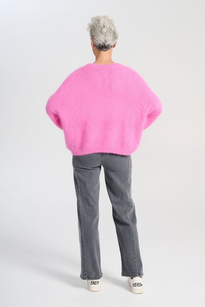 Crafted in an impossibly soft angora blend, this jumper will keep you warm on the greyest of days while still staying comfortable and light. Back full length view on model