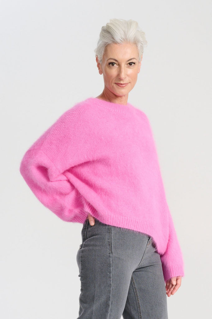Crafted in an impossibly soft angora blend, this jumper will keep you warm on the greyest of days while still staying comfortable and light. Side view on model