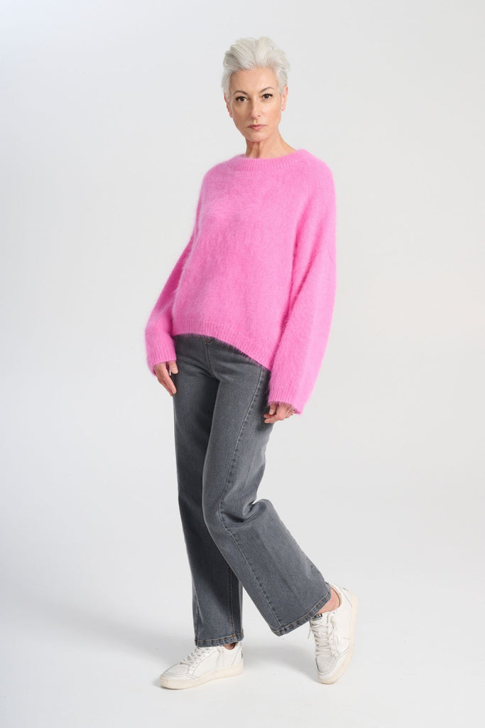 Crafted in an impossibly soft angora blend, this jumper will keep you warm on the greyest of days while still staying comfortable and light. Side front view on model