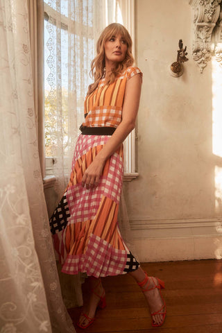 Olga de Polga Pleated skirt in our Pink Central Park print. Elasticated waistband. Midi length. Side front view