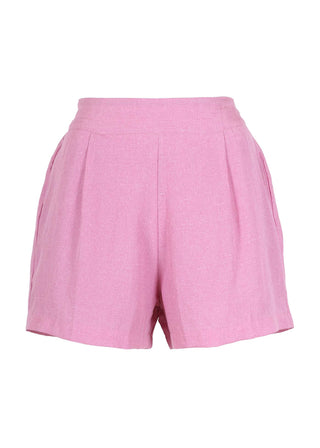 Olga de Polga Le Bon Shorts in Pink linen blend. 60% Tencel, 40% Fine Linen. Flat front, elastic waistband at the back.  Relaxed, loose fit. Front view