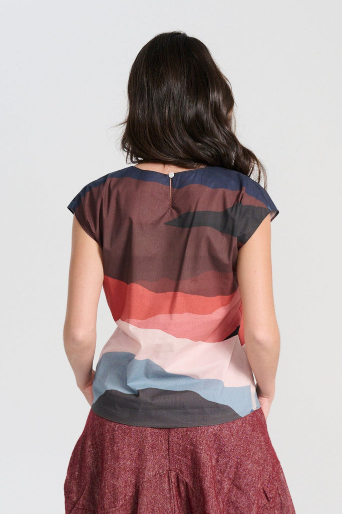 Olga de Polga New Kona printed cotton tee. Back view on model. Round neckline, cap sleeves, finishes at the hip. Back view