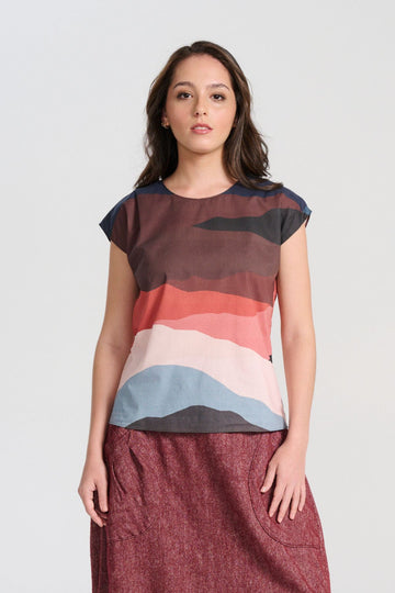 Olga de Polga New Kona printed cotton tee. Front view on model. Round neckline, cap sleeves, finishes at the hip. Front close-up view on model