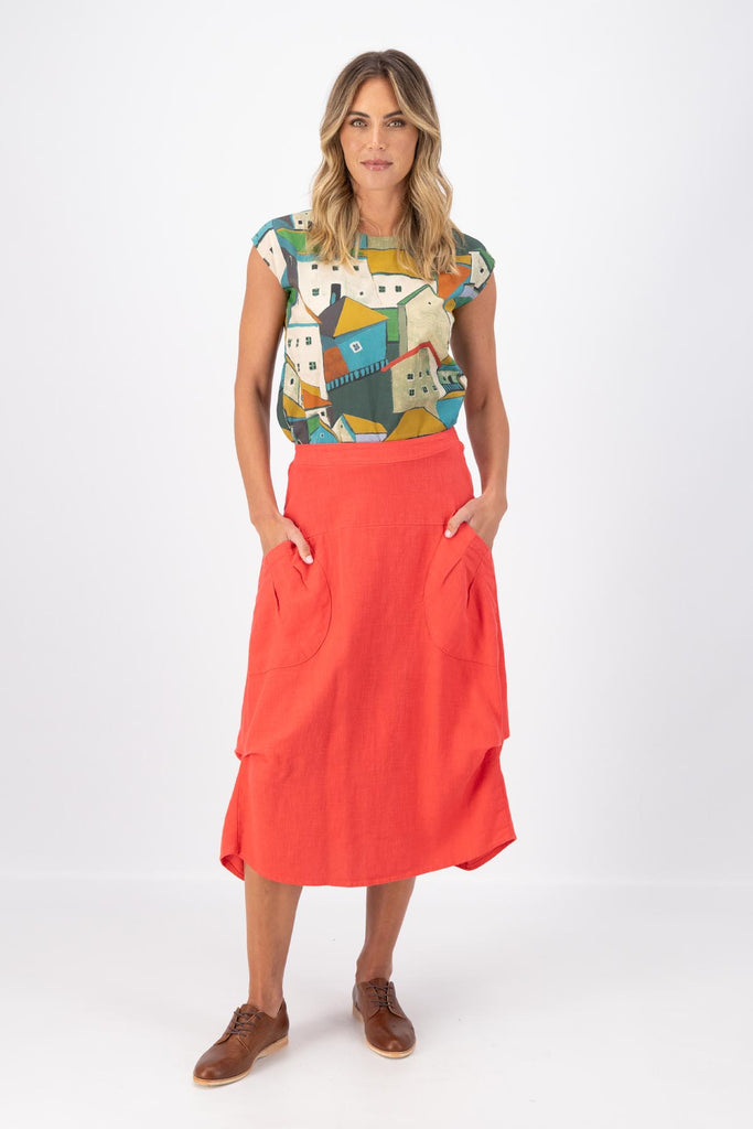 Olga de Polga Milwaukee Fiesta skirt in Watermelon Red.  Milwaukee Fiesta Skirt in 100% slub linen is an incredibly unique, chic and original skirt. It is universally flattering, highly versatile, and super comfortable. Perfect to throw on and go. Front full length view on model.