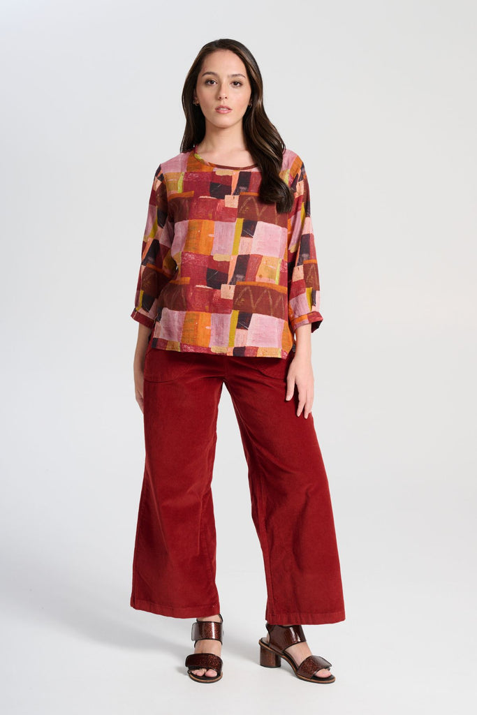 Olga de Polga Vino Peggy Sue Pants in soft velvet corduroy.  Also available in a long length. Front view with pink top
