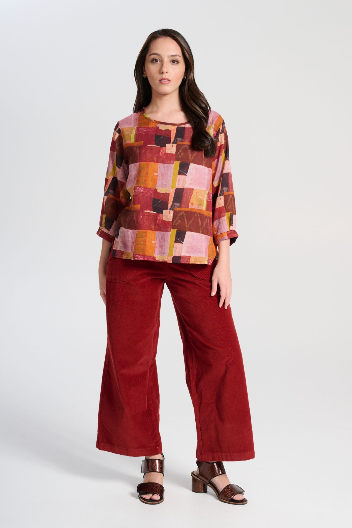Olga de Polga Vino Peggy Sue Pants in soft velvet corduroy.  Also available in a long length. Front view with pink top
