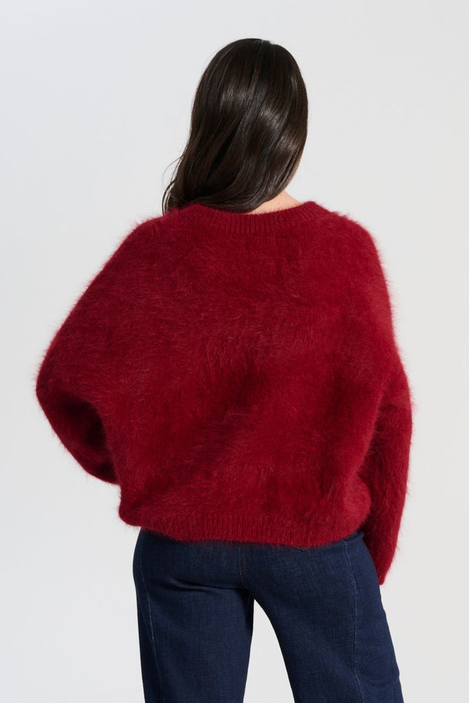 Crafted in an impossibly soft angora blend, this jumper will keep you warm on the greyest of days while still staying comfortable and light.  Back view on model
