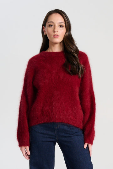 Olga de Polga angora Montreal Knit sweater in Vino red. Crafted in an impossibly soft angora blend, this jumper will keep you warm on the greyest of days while still staying comfortable and light. Front view on model