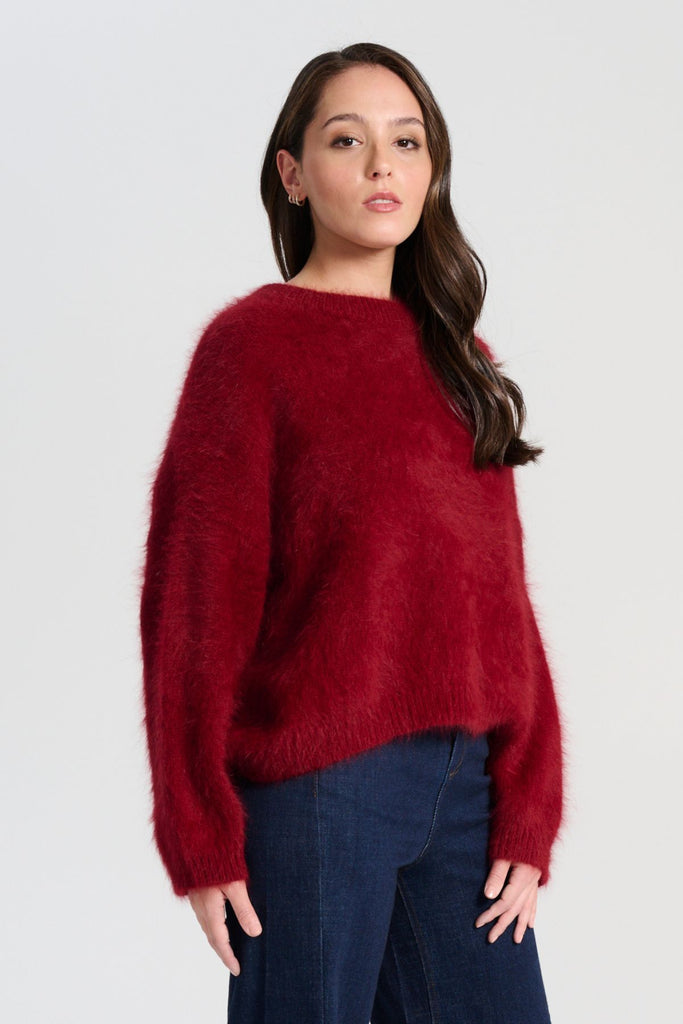Crafted in an impossibly soft angora blend, this jumper will keep you warm on the greyest of days while still staying comfortable and light. Side view on model