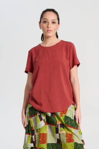 Olga de Polga Rhea Top in Rust. 100% Tencel. Round neckline and short sleeves. A boxy t-shirt shape in a soft silky Tencel fabric. Front close-up view