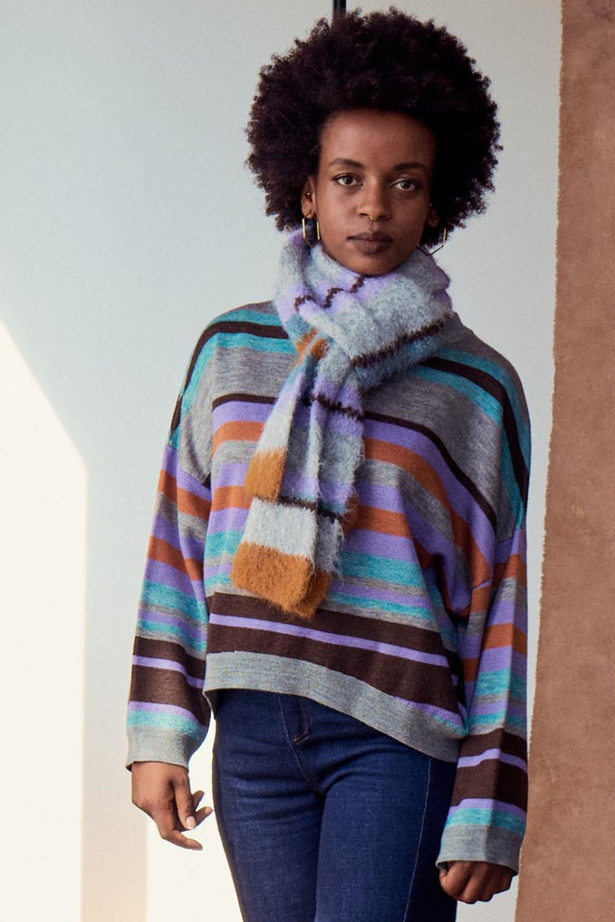 Olga de Polga striped mohair knit scarf in grey, lilac and tan on model.
