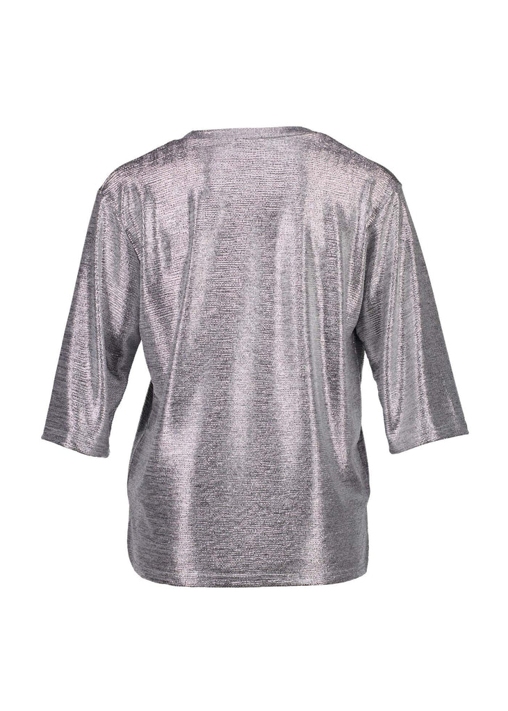 Olga de Polga silver prosecco top. Crafted from a soft, woven metallic fabrication, this top is comfortable enough to wear all day and night. With a relaxed fit, scoop neckline, and 3/4 length sleeves, your everyday t-shirt now boasts a lustrous twist.  Back