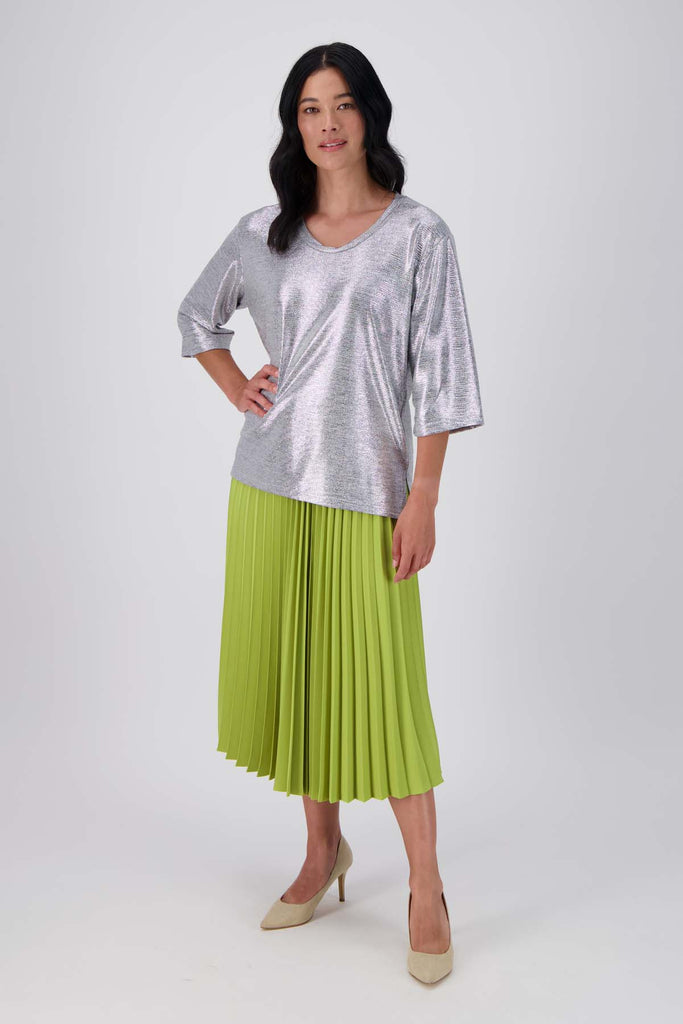 Olga de Polga silver prosecco top. Crafted from a soft, woven metallic fabrication, this top is comfortable enough to wear all day and night. With a relaxed fit, scoop neckline, and 3/4 length sleeves, your everyday t-shirt now boasts a lustrous twist.  Front full length view on model.