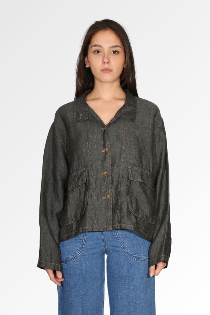 The Billie jacket in Slate by Olga de Polga is crafted from a luxurious 100% linen fabric. Button front, long sleeves. Large front patch pockets.  Front view on model