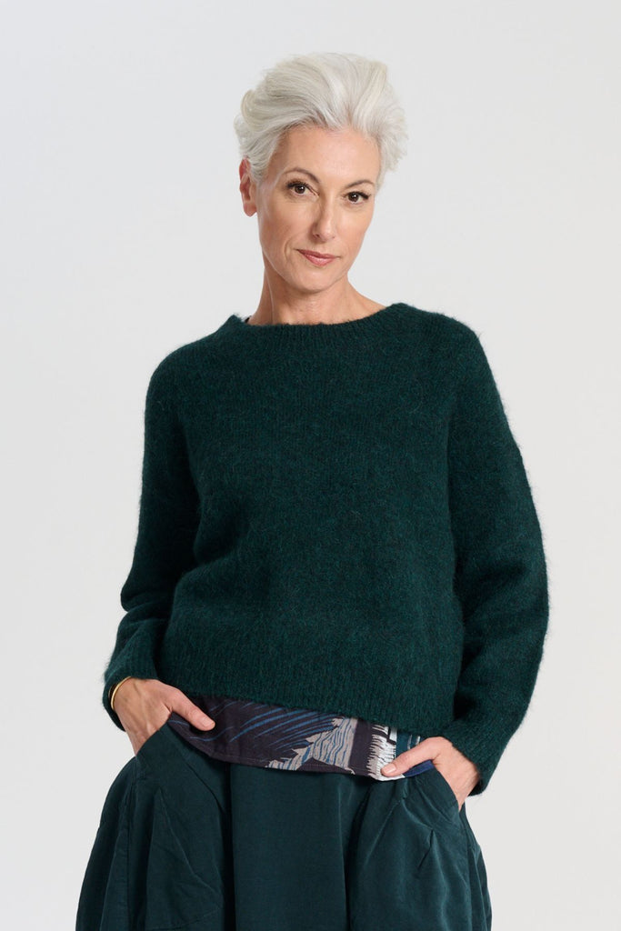 Olga de Polga Teal Aspen knit Sweater in Alpaca. Ribbing at neckline, cuff and hemline. Front view on model.