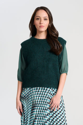 Olga de Polga Teal dark green Aspen Knit Vest in alpaca. A beautifully textured knit vest—your perfect layering essential for effortless, trans-seasonal styling. Front veiw on model.
