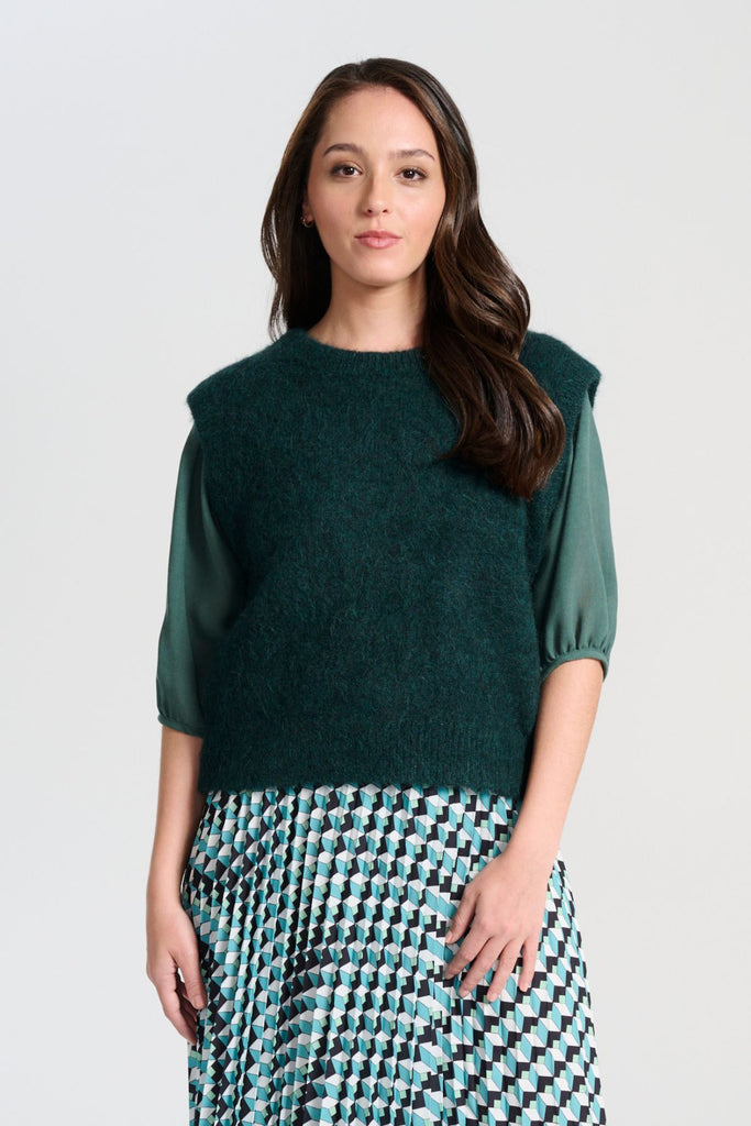 Olga de Polga Teal dark green Aspen Knit Vest in alpaca. A beautifully textured knit vest—your perfect layering essential for effortless, trans-seasonal styling. Front veiw on model.