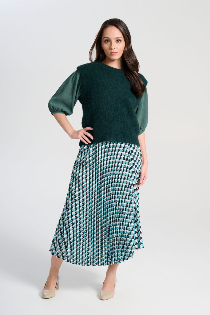 Olga de Polga Teal dark green Aspen Knit Vest in alpaca. A beautifully textured knit vest—your perfect layering essential for effortless, trans-seasonal styling. Front full length view on model