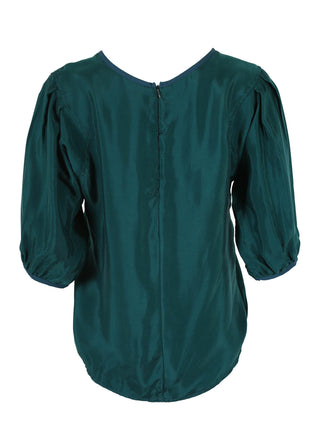 Olga de Polga classic blouse in Teal Bordeaux Cupro Twill, with a round neckline and half sleeves, this blouse finishes at the hip. Back view