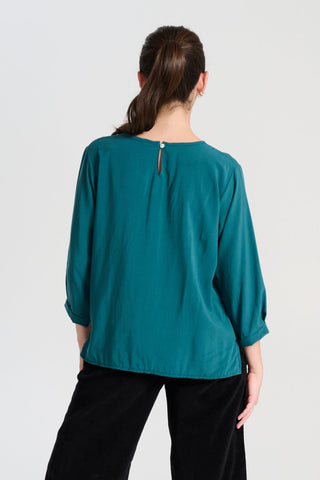 Olga de Polga Teal Rhea Chemise Blouse in 100% fine Tencel. Back view on model