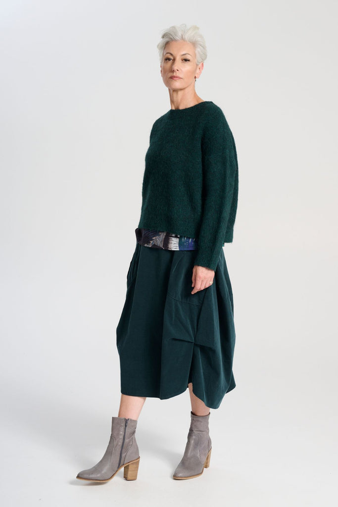 Olga de Polga Teal Milwaukee Marlowe cord skirt in 100% cotton. Comfy waistband making it the perfect throw-on-and-go! Side view on model